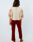 Straight leg fall jeans, stretchy jeans for fall, reddish-brown colored jeans, rust colored pants