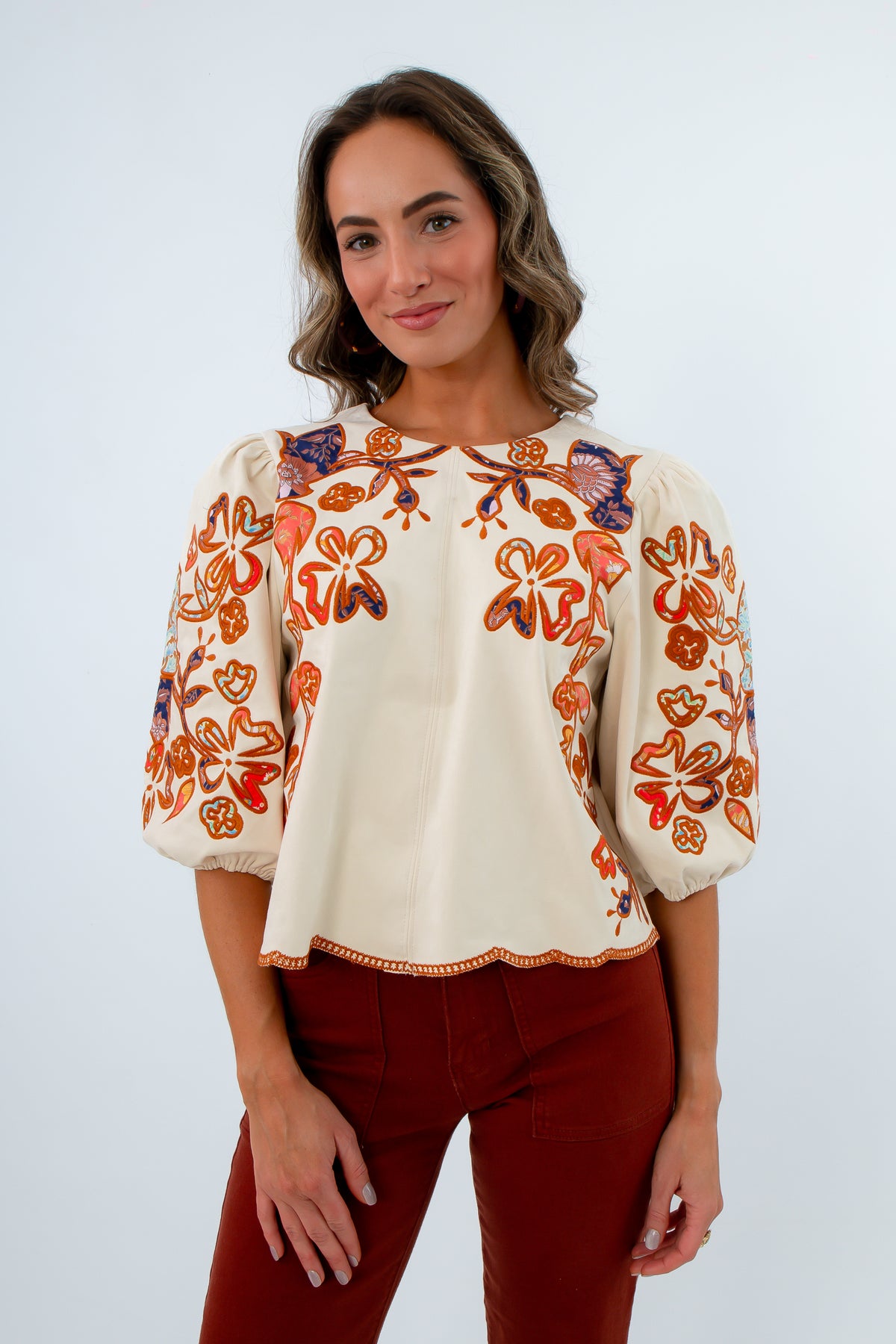 Cream top with colorful suede embroidery, cream suede top with fall floral detail, fall workwear, fall blouses