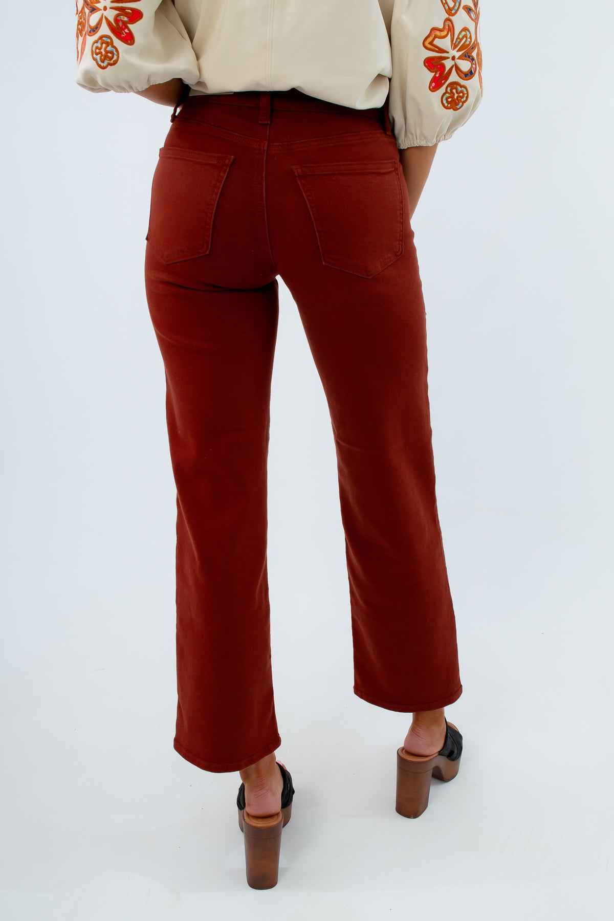 Rust colored jeans for fall, women's fall pants, thanksgiving outfit inspo, fall colored pants for thanksgiving