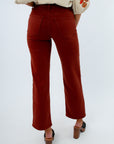 Rust colored jeans for fall, women's fall pants, thanksgiving outfit inspo, fall colored pants for thanksgiving