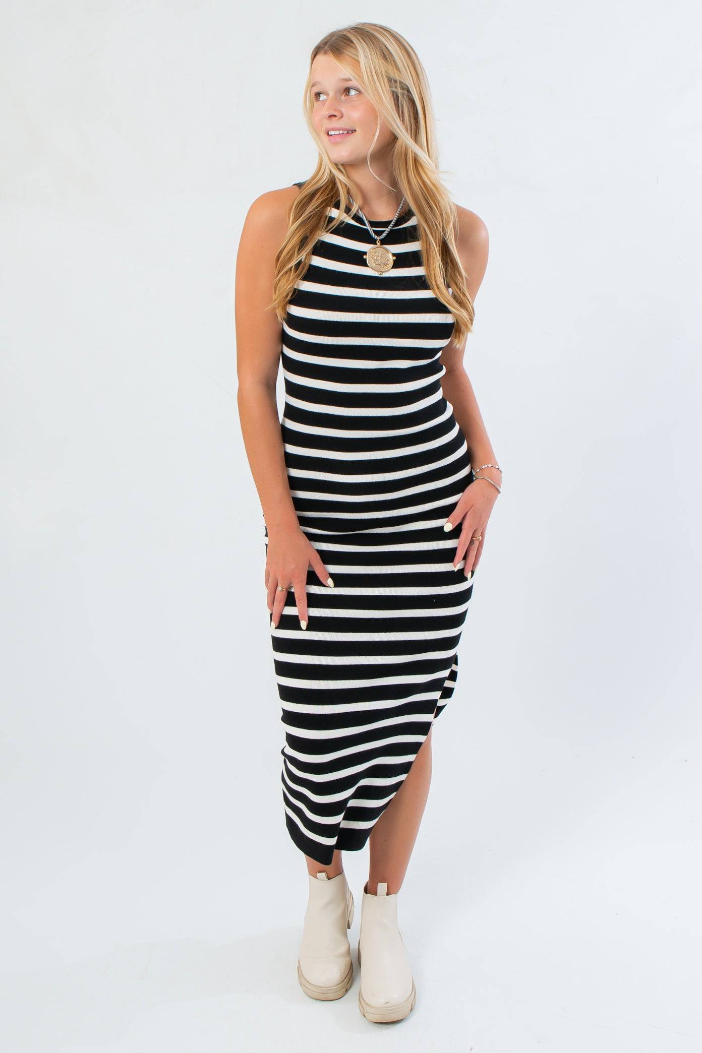 Black & White Stripe Midi Dress in fitted knit design, featuring bold horizontal stripes and a flattering silhouette for fall fashion.