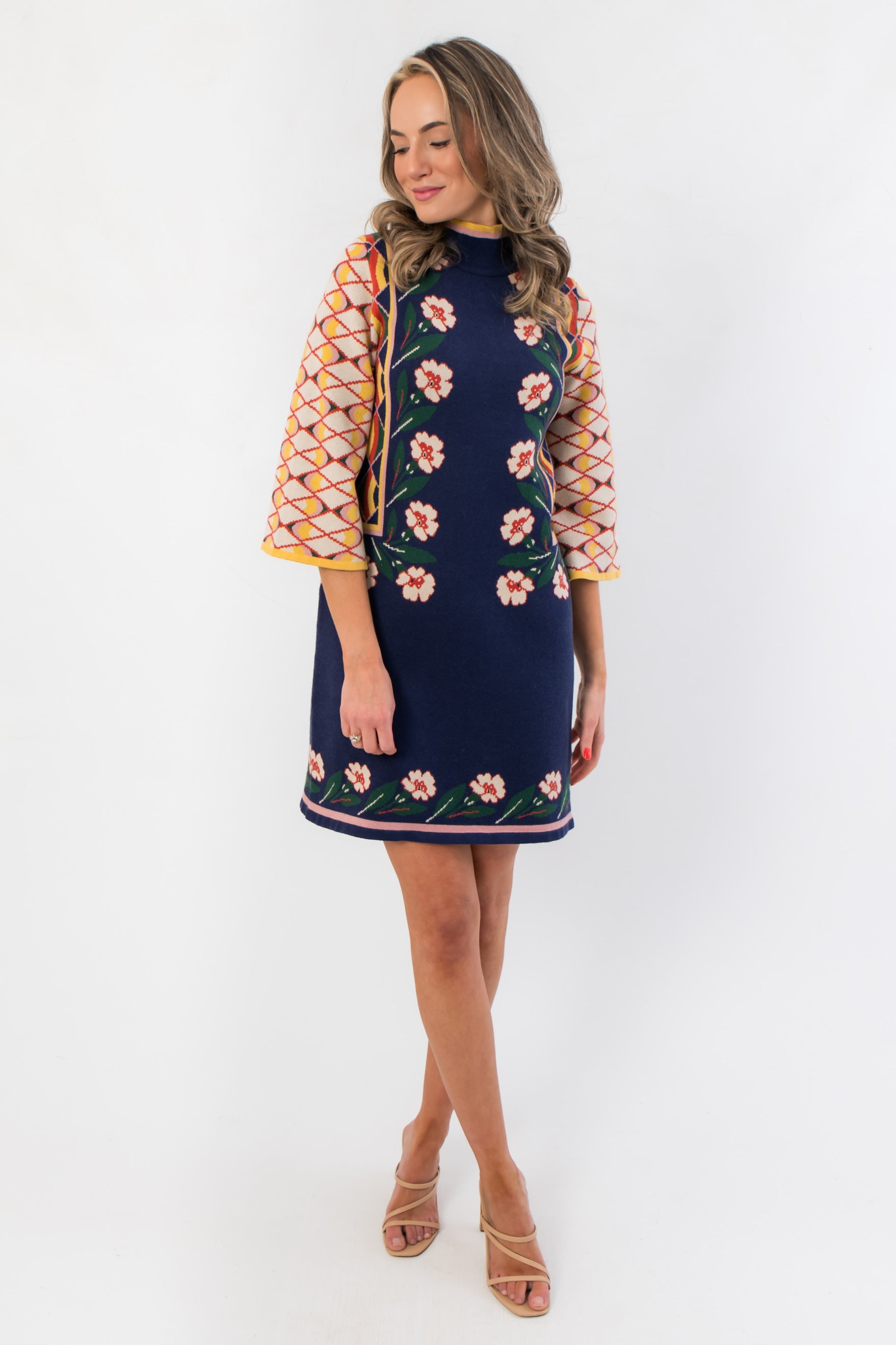 Penny Lane Navy Jacquard Sweater Dress with floral front design, mock neckline, and flared sleeves, ideal for cozy fall fashion.