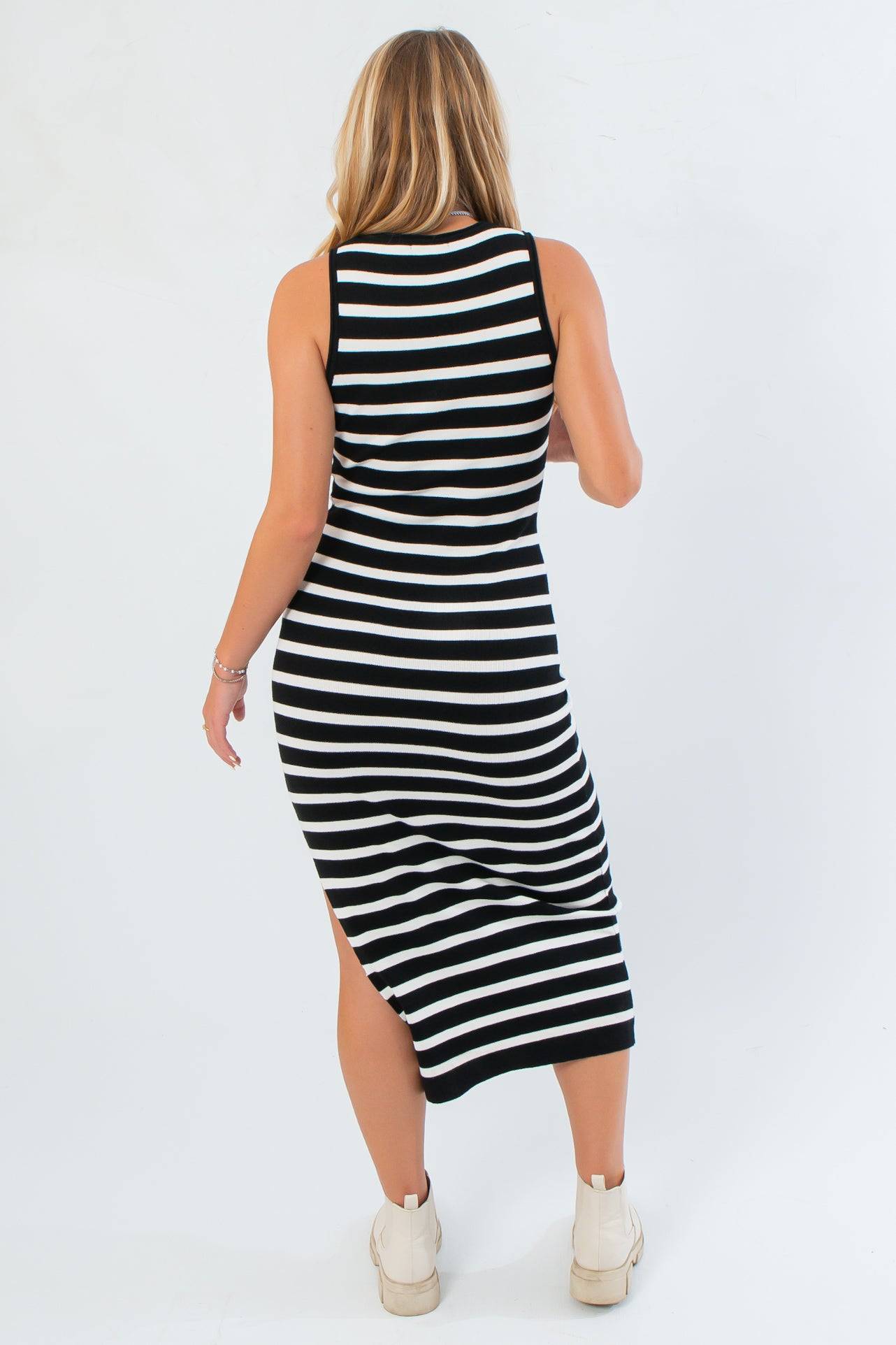 Back view of Yard Lines Black &amp; White Stripe Midi Dress showing racerback cut and body-hugging knit fit for a sleek, modern look.