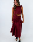 Women’s garnet-burgundy skirt set with boxy crop top, flattering skirt and intricate trim details