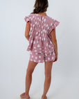 Pink two-piece set with pockets, pink and white polka dot shorts and matching blouse
