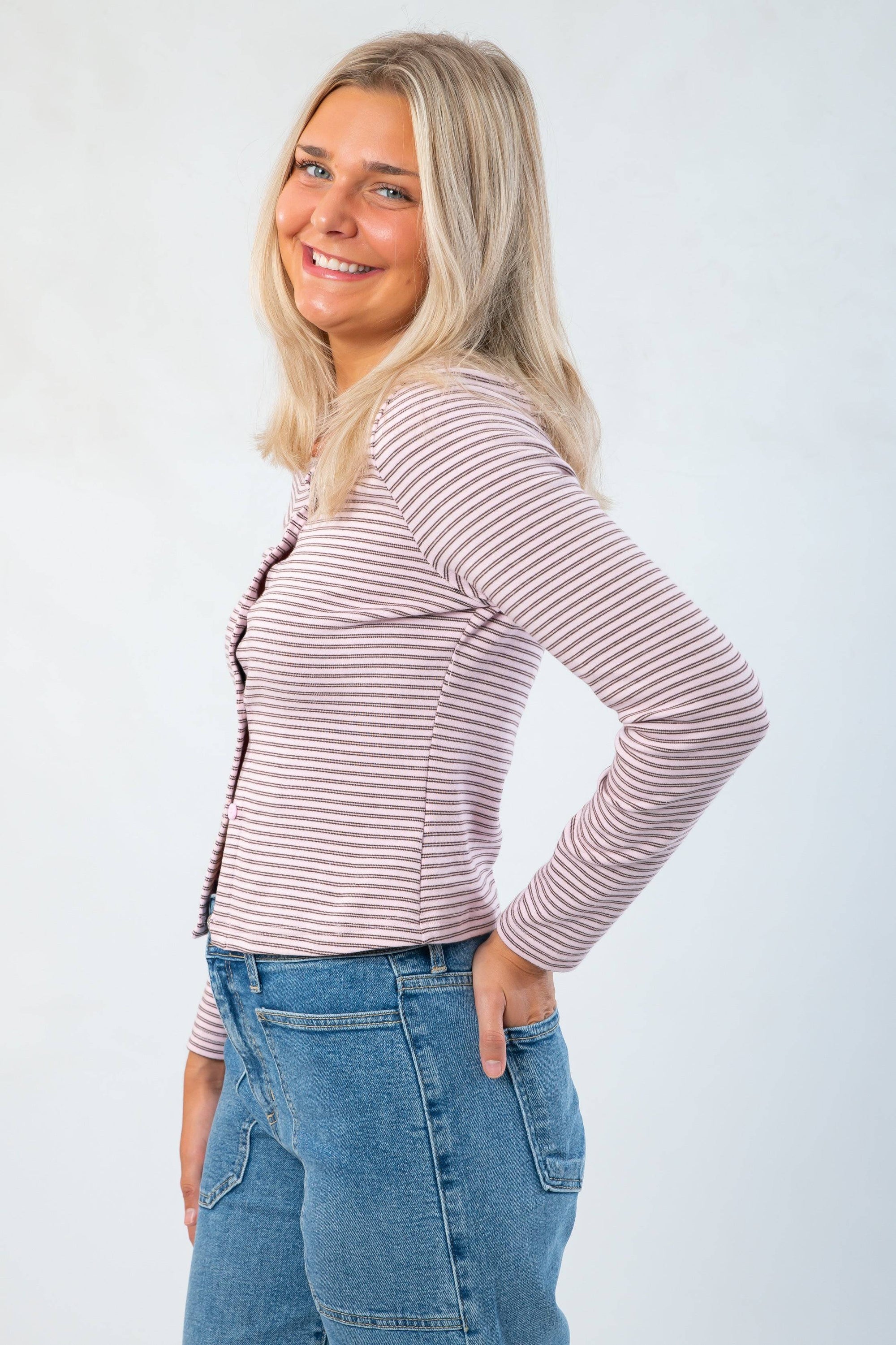 Side view of Carry On Pink & Brown Striped Button Front Top showing fitted silhouette and soft ribbed texture, ideal for fall layering.