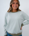 Blue and white striped sweater with green trim, Blue and white long sleeve top with green trim