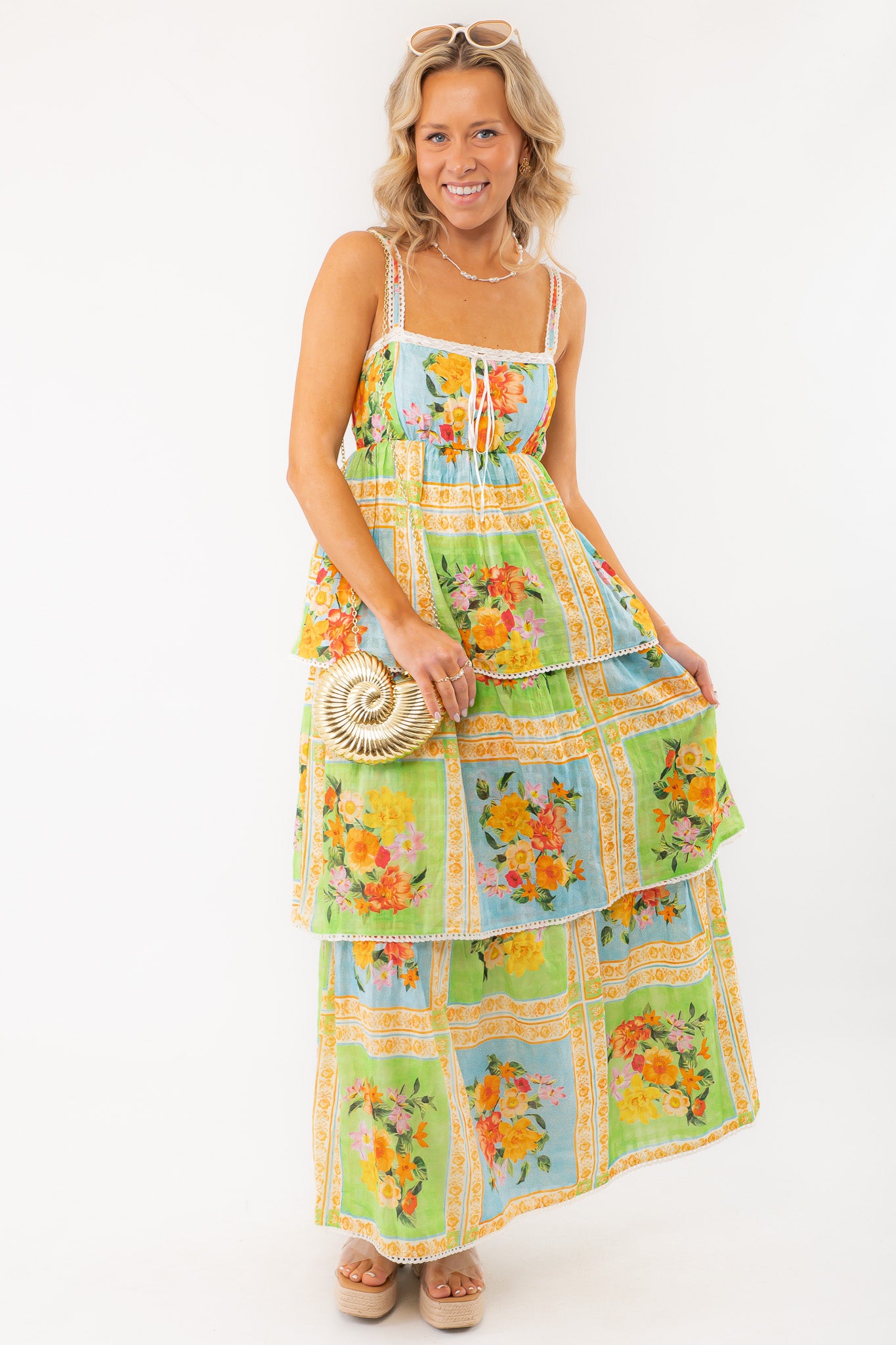 Show Me Your Mumu Peyton Country Bouquet Midi Dress featuring a vibrant floral print, smocked bodice, and tiered skirt, perfect for summer outings.