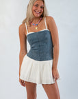 Shop Denim Tiffany Skort Dress at Show Me Your Mumu featuring a strapless denim bodice and cream voile skort bottom, ideal for trendy fall looks.
