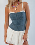 Close-up of Show Me Your Mumu Denim Tiffany Skort Dress with structured denim top and pleated cream voile skirt, perfect for gameday or casual outings.