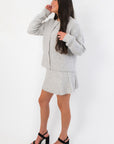 Side view of Livia Grey Button Up Sweater Skirt Set showing ribbed knit skirt and relaxed cardigan fit, great for versatile styling.