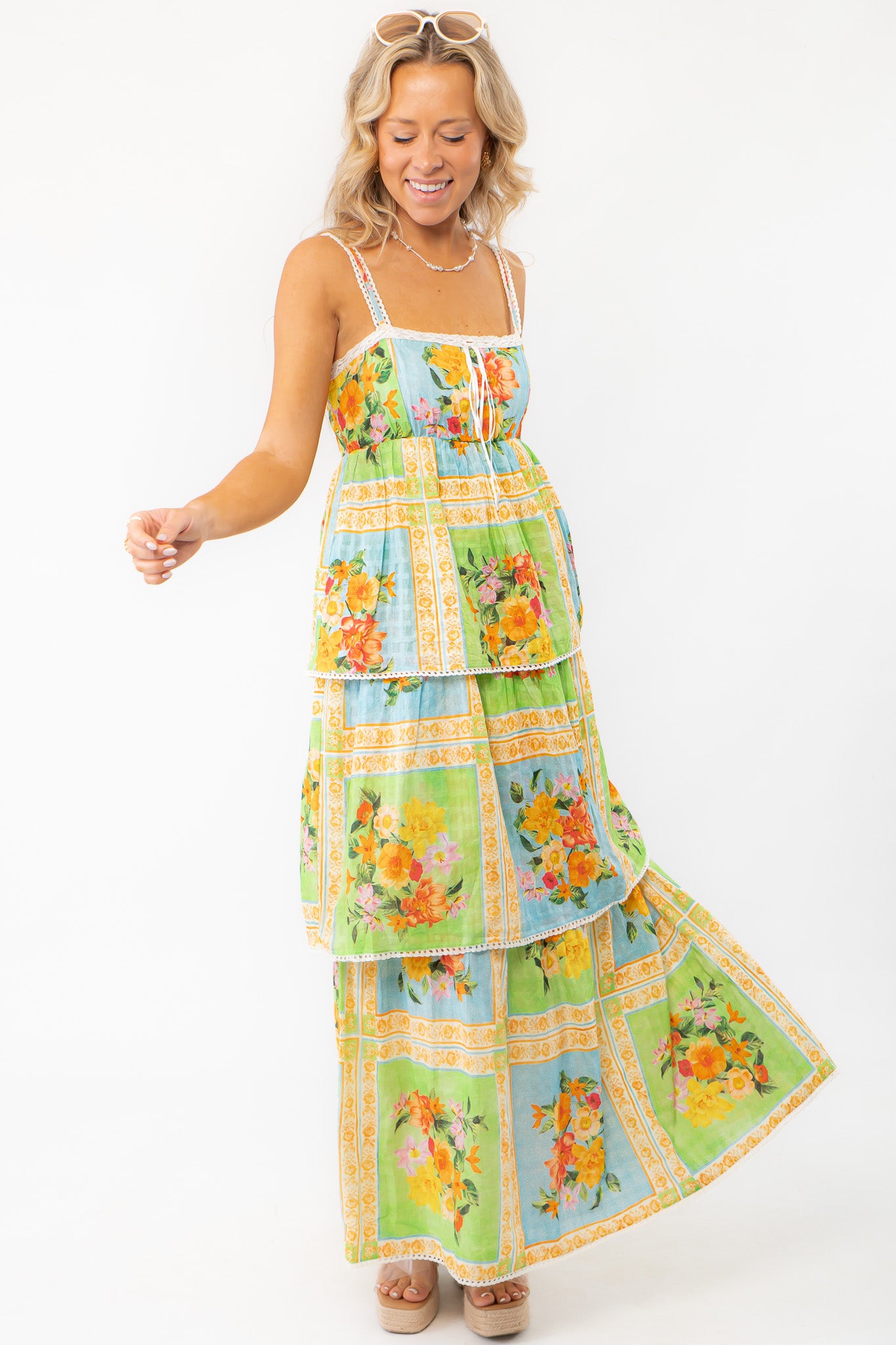 Fun and flowy Show Me Your Mumu Peyton Country Bouquet Midi Dress with a bright floral pattern, adjustable straps, and tiered layers for a breezy look.