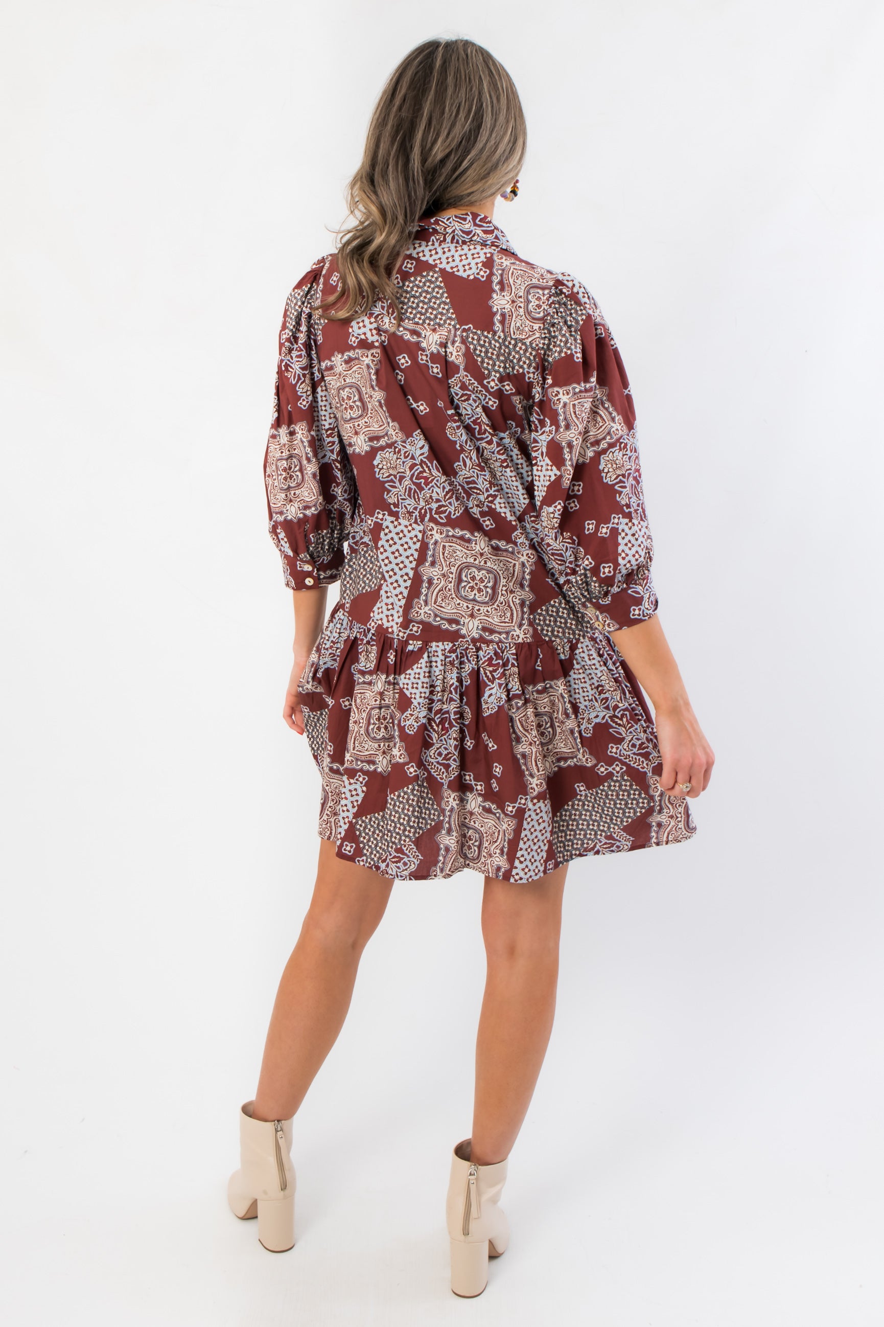 Back view of Scottie Burgundy Print Tiered Mini Dress with flowy tiered hem and gathered waist, a chic option in short dresses for everyday style.