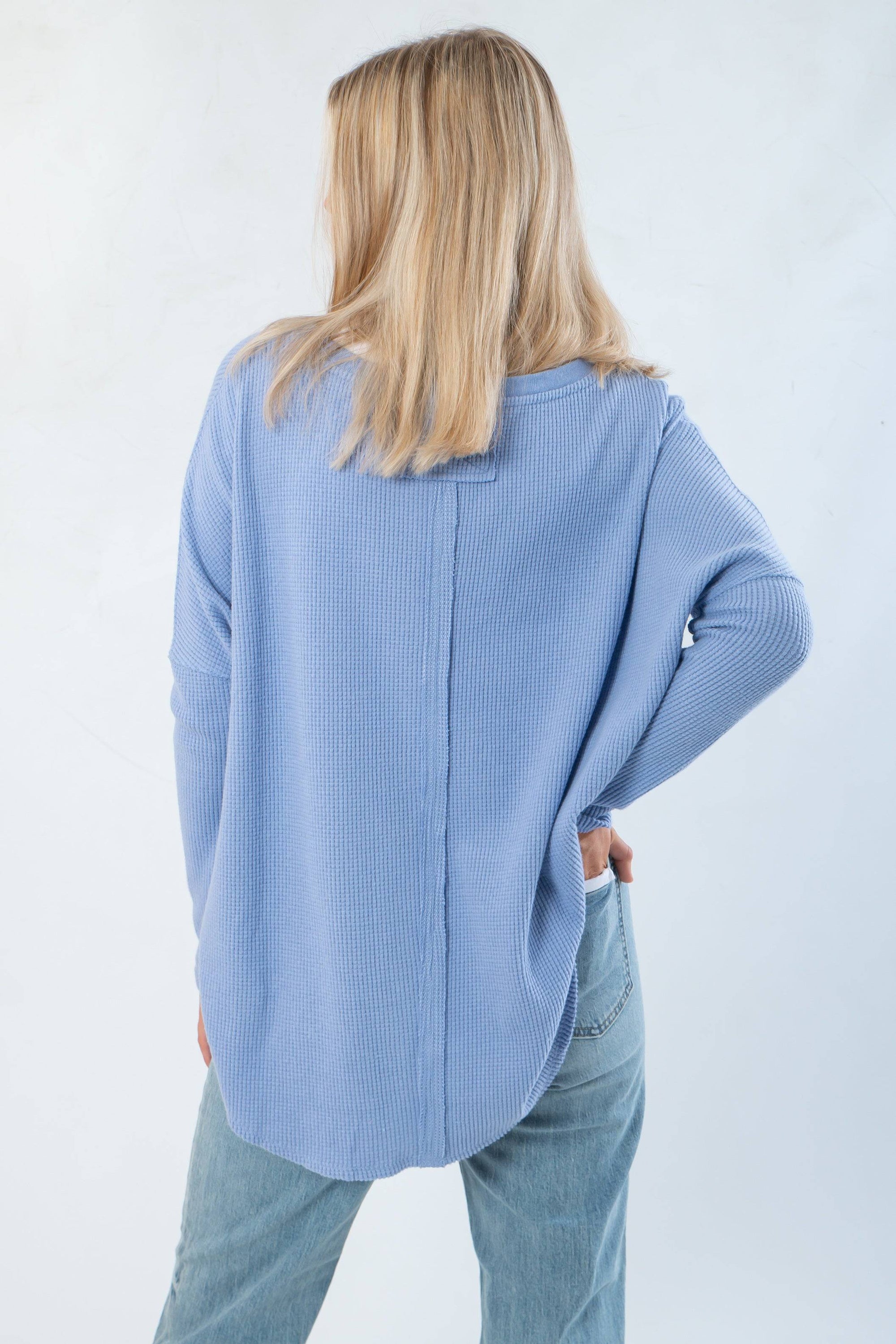 Back view of Free People Dawn Breeze Latte Blues Solid Thermal highlighting center seam detail and flowy silhouette for laidback layering style.