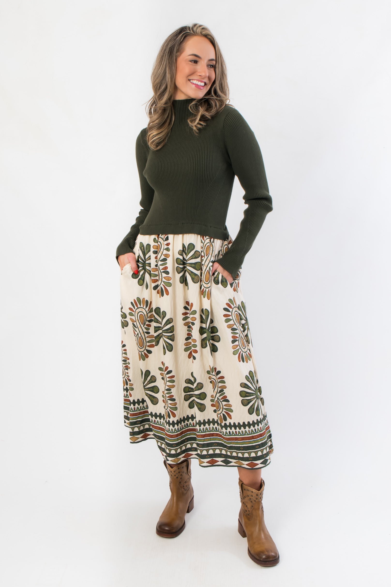 Channing Olive Green Contrast Midi Dress with ribbed knit bodice and printed skirt, styled with brown ankle boots for fall fashion.