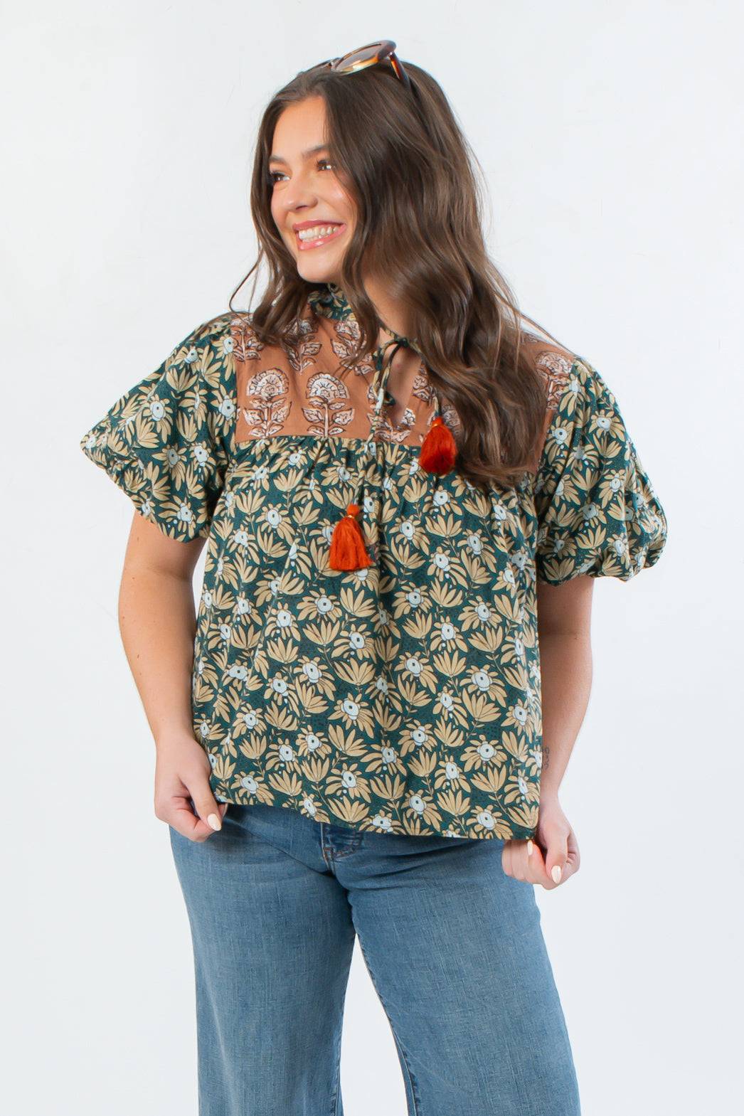 THML Green Floral Color Block Puff Sleeve Top with tie neck and puff sleeves, styled with denim for a trendy fall outfit.