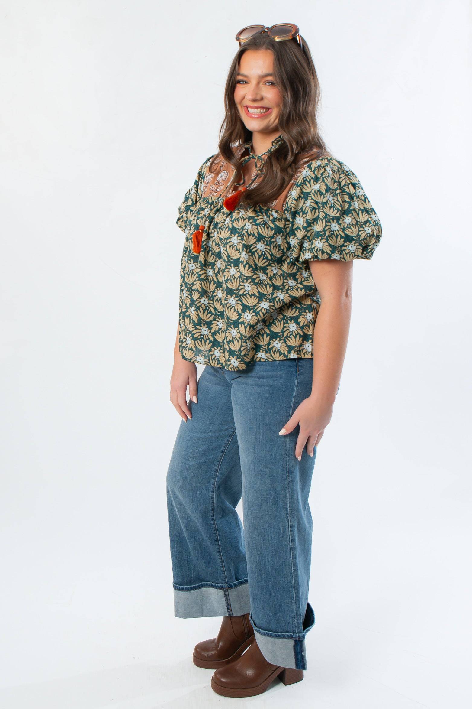 Side view of THML Green Floral Color Block Puff Sleeve Top showing puff sleeves and floral pattern, styled for autumn wear.