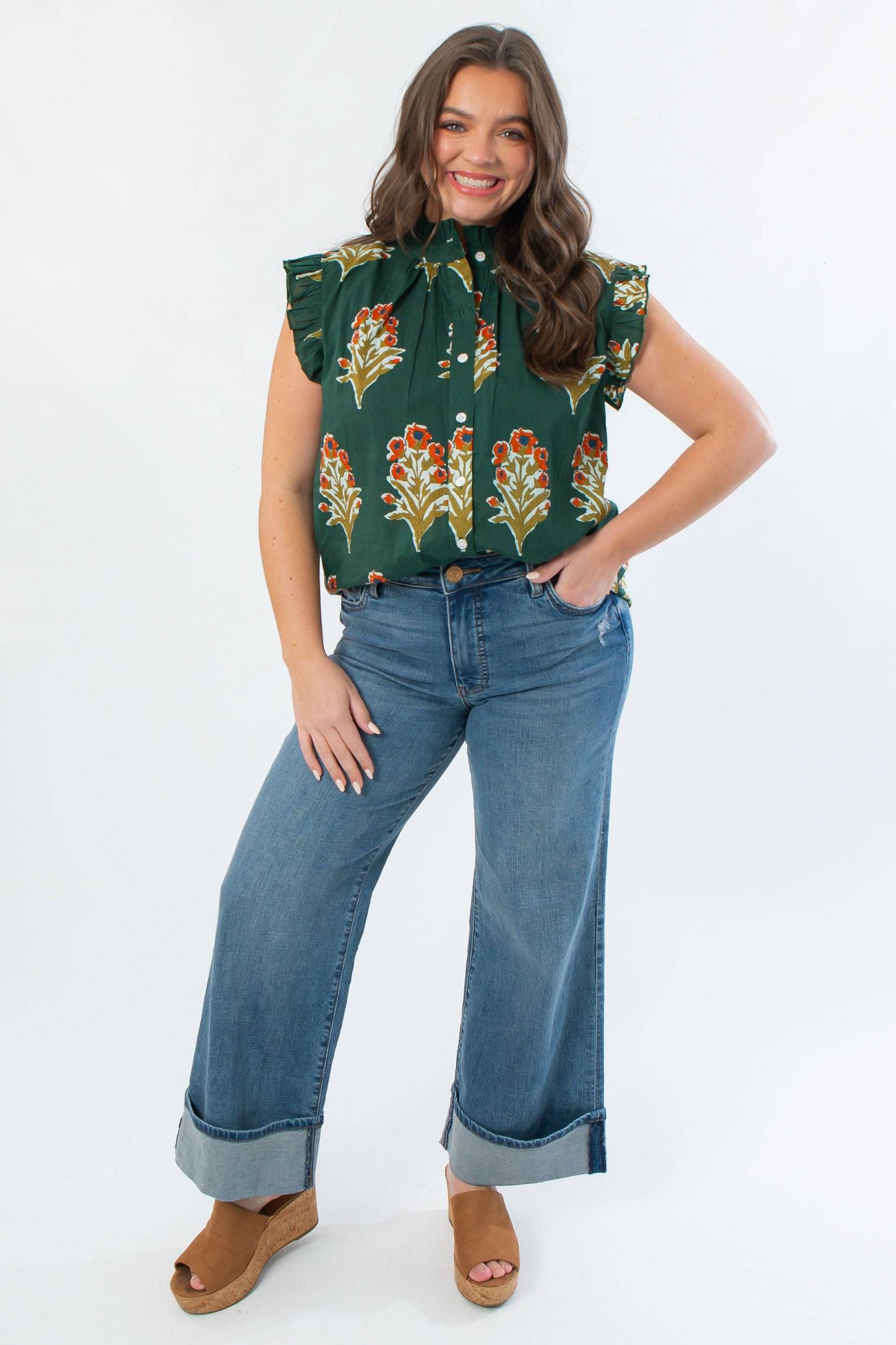 Front view of THML Dark Green Ruffle Sleeve Block Floral Print Blouse featuring button front and floral design, ideal for workwear or casual outings.