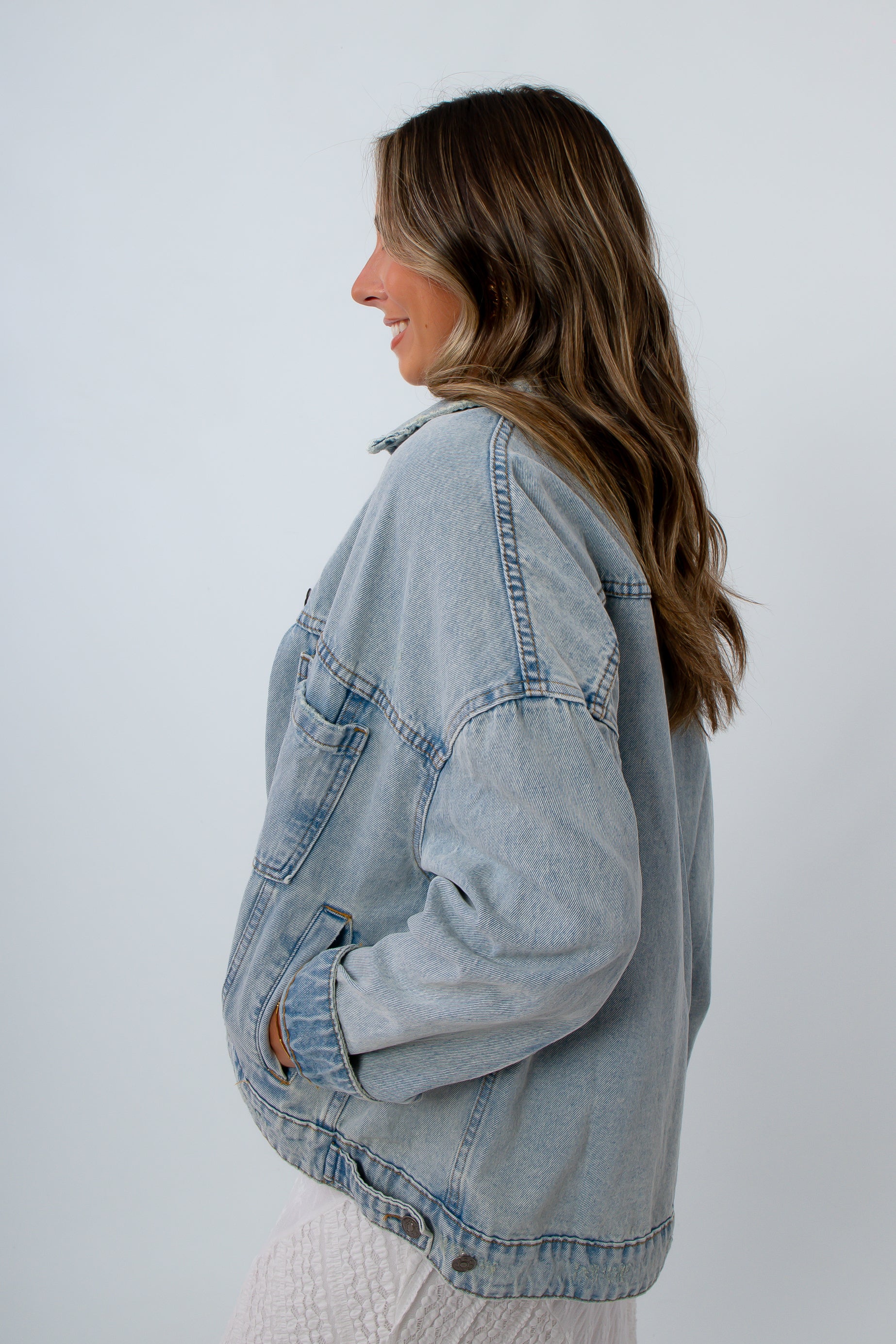 Vintage-inspired light wash denim jacket with oversized fit, oversized denim jacket with pockets