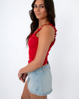 Back view of red ruffled tank top with shoulder straps