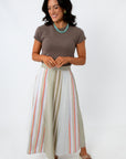 woman wearing striped midi skirt with side pockets and elastic waistband