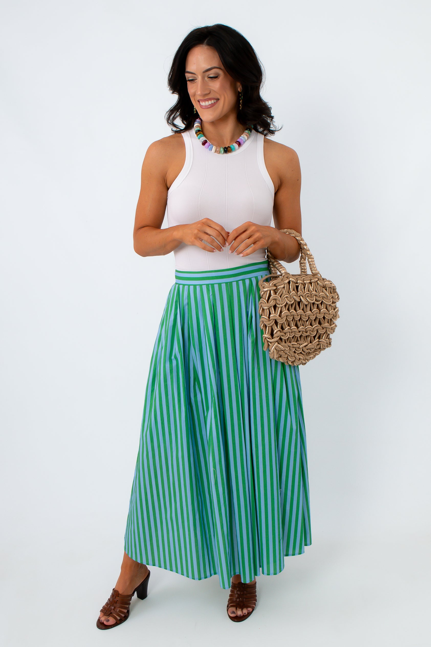 Green and blue striped midi skirt with side pockets and elastic waistband
