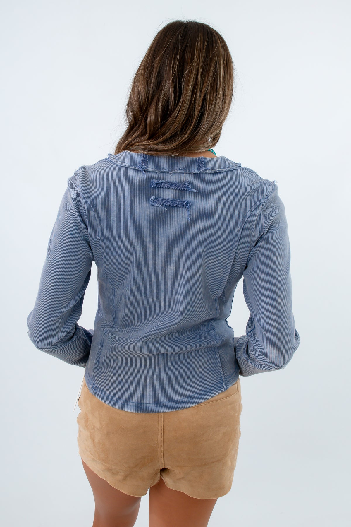 Blue henley top with ribbed fabric and button detailing, blue ribbed long sleeve shirt, blue ribbed henley, blue long sleeve shirt with floral detailing