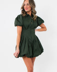 Side view of Arden Hunter Green Bubble Dress showing structured puff sleeves, fitted waist, and voluminous bubble hem design.