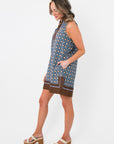 Side view of Maureen Chambray Medallion Shift Dress – Floral Sleeveless V Neck showing relaxed fit and brown hemline detail.