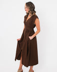 Side view of the Brownstone Front Zip Sleeveless Midi Dress showing its structured fit, midi length, and flowy skirt for effortless style.