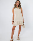 Reese Ecru Linen Pleat Hem Mini Dress model pose