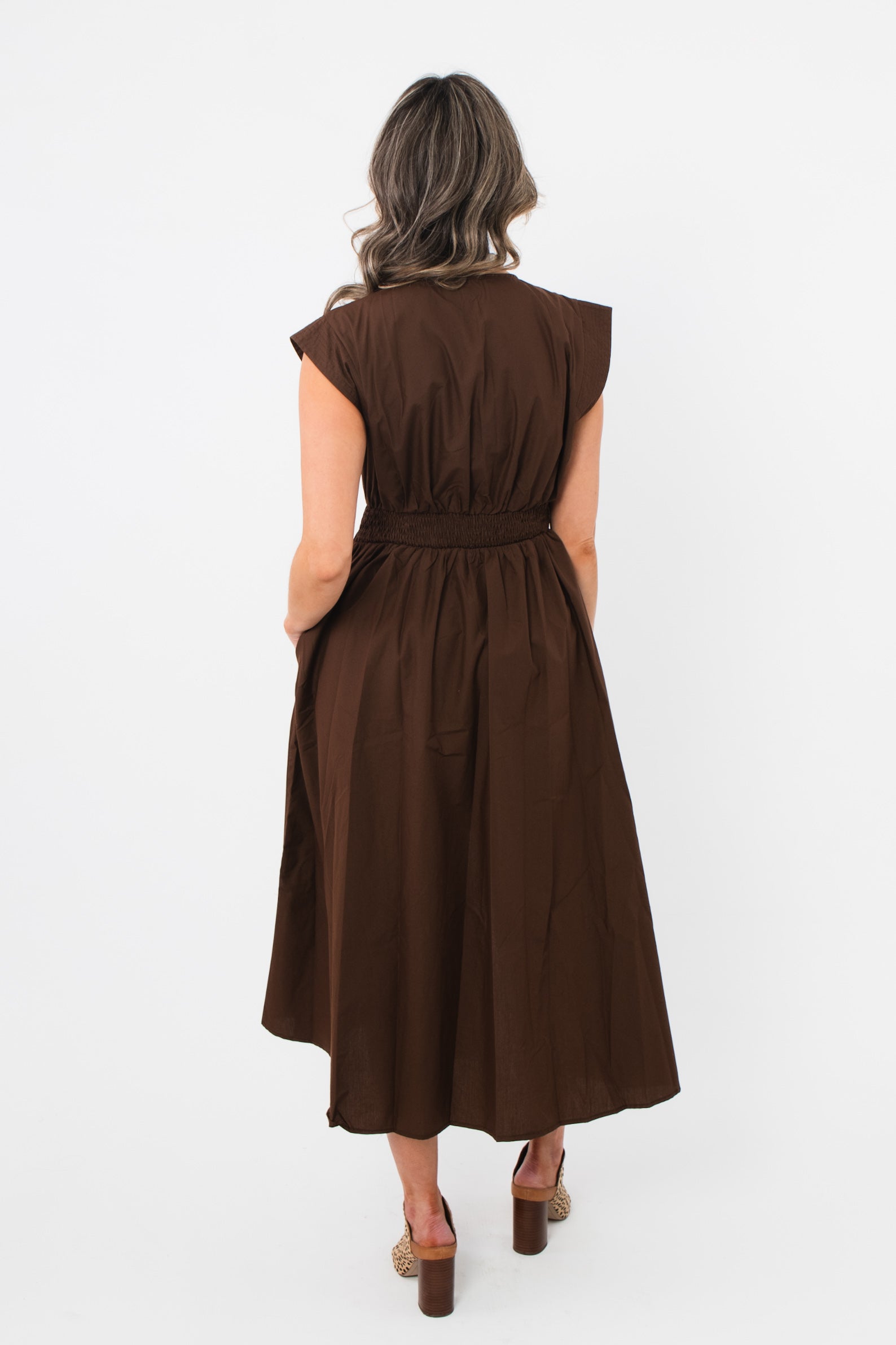 Back view of the Brownstone Front Zip Sleeveless Midi Dress highlighting the elastic cinched waist and soft fabric drape for all-day comfort.