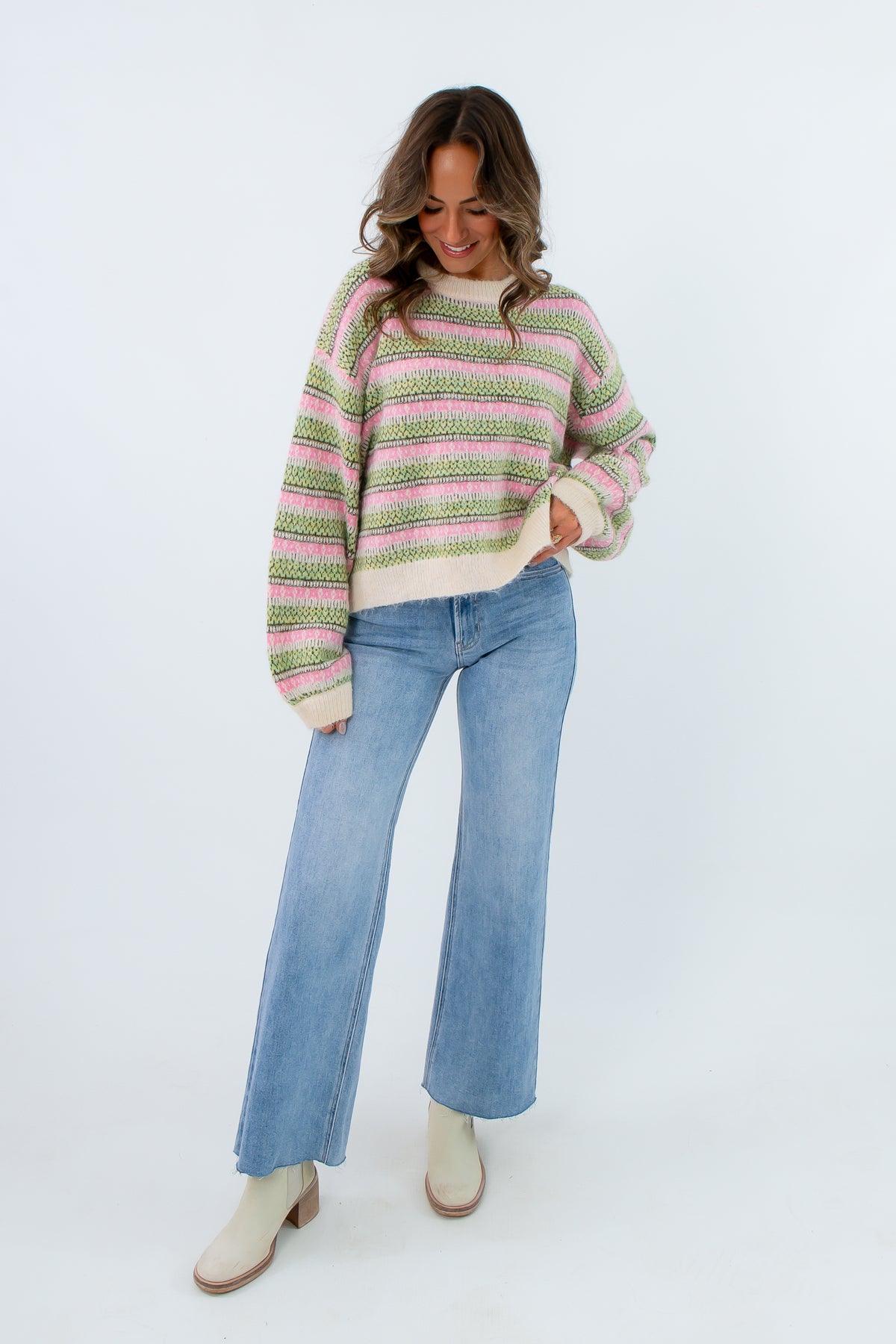 Patterned knit sweater
Soft pink and green striped sweater
