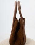 Free People Cognac Barlow Bucket Bag with fixed top straps, Brown suede fall purse with fully lined interior, Suede fall shoulder bucket bag perfect for autumn outfits
