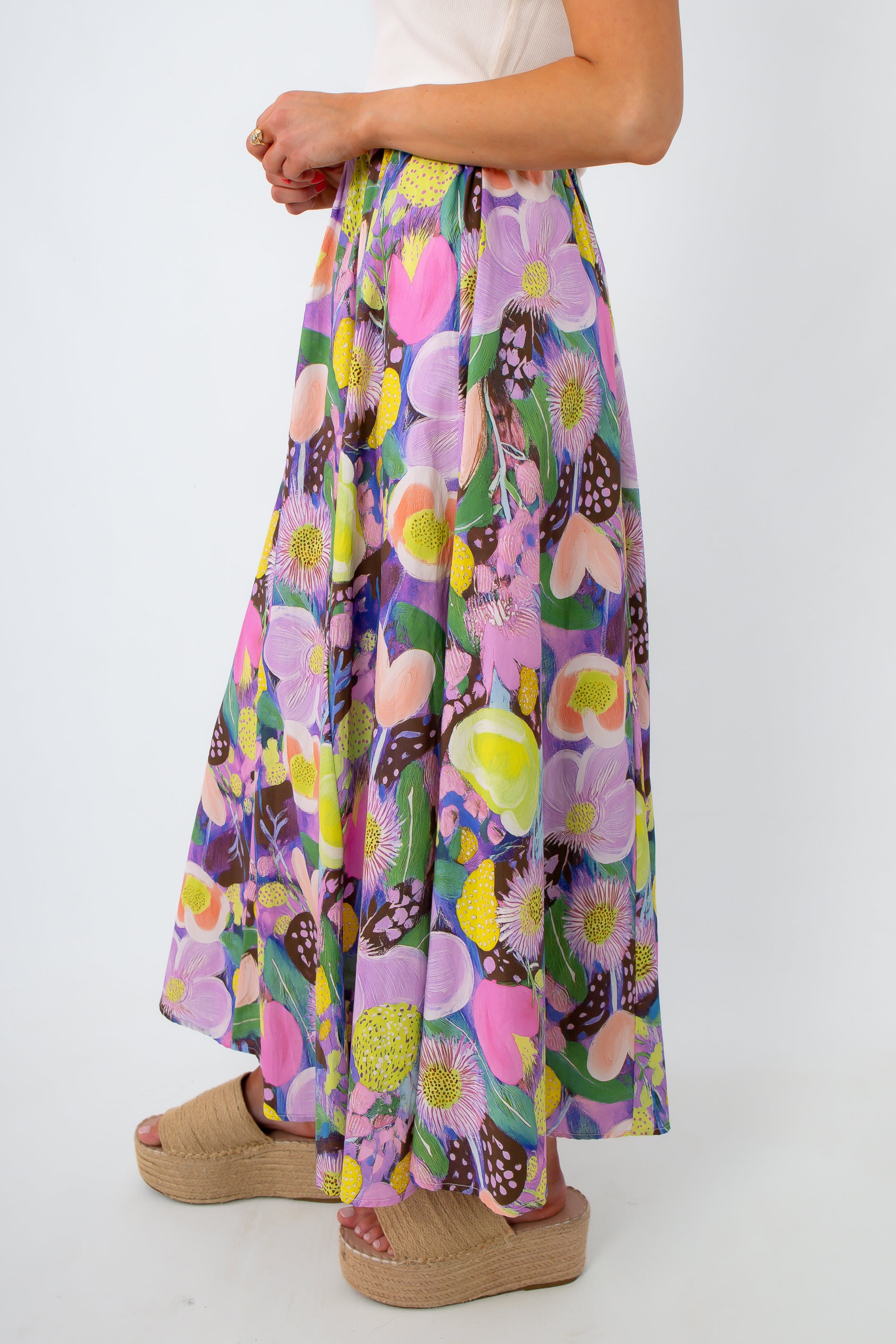 Close-up of floral maxi skirt with pink, purple, and yellow flowers