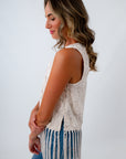 Sleeveless ivory top with side buttons, ivory tops with fringe, ivory tops with embroidered detailing