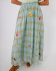 Spring-ready plaid midi skirt featuring colorful Easter egg designs