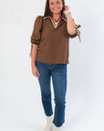 Front view of Hazel Brown Whipstitch Collared Blouse featuring contrast trim and structured silhouette, ideal for fall wardrobe updates.