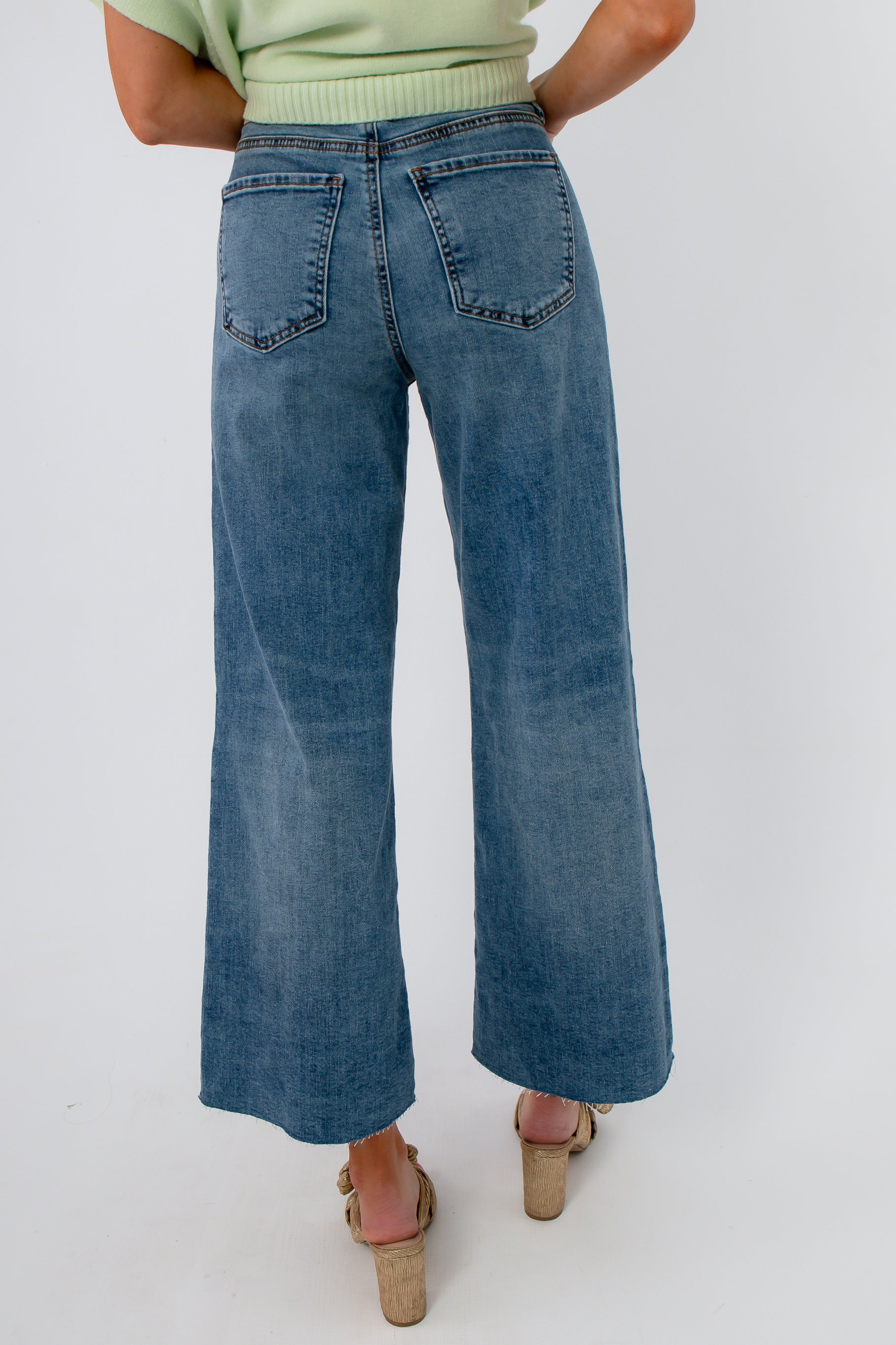 Back view of high rise wide leg denim jeans