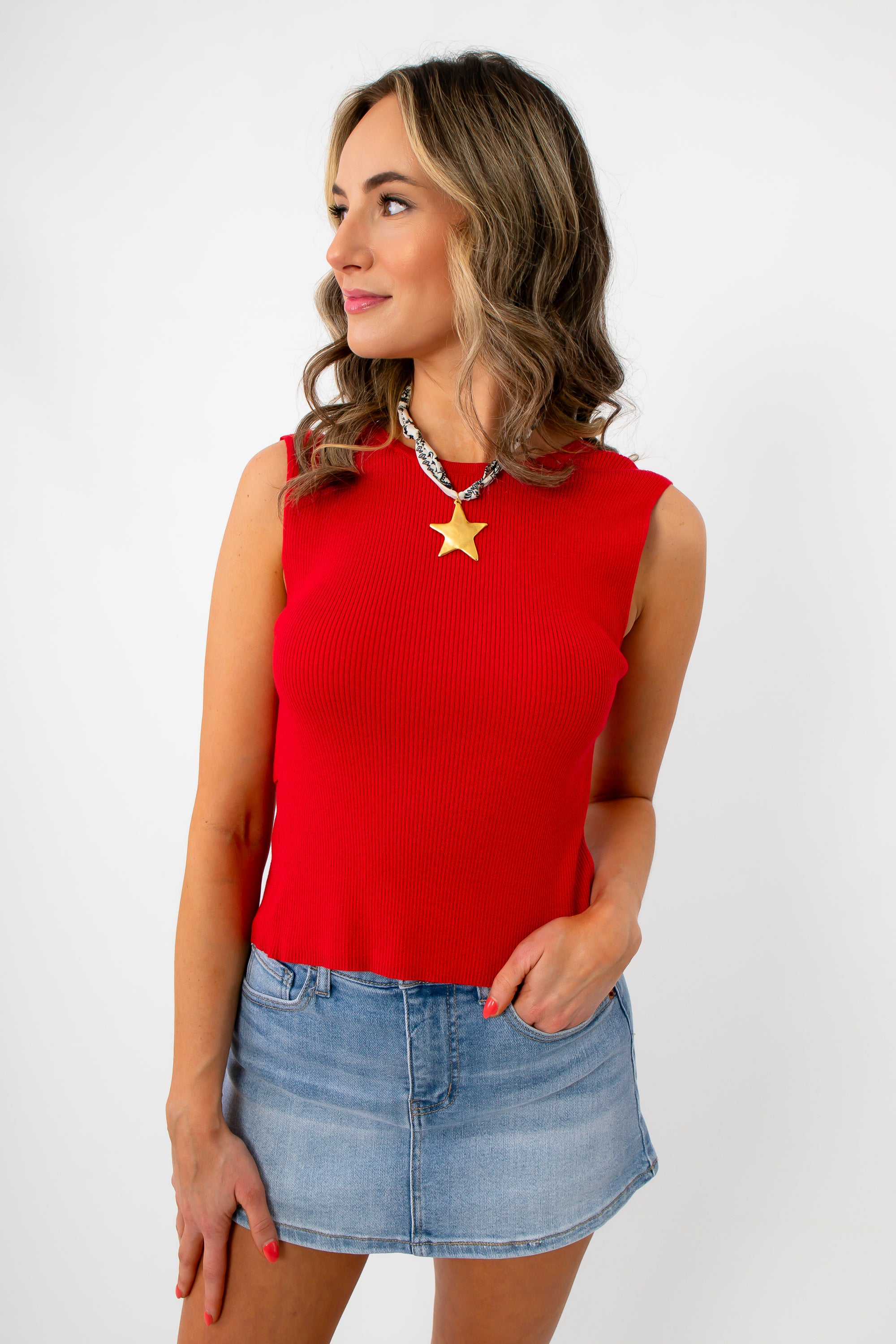 Red sleeveless knit top with open back and fitted style