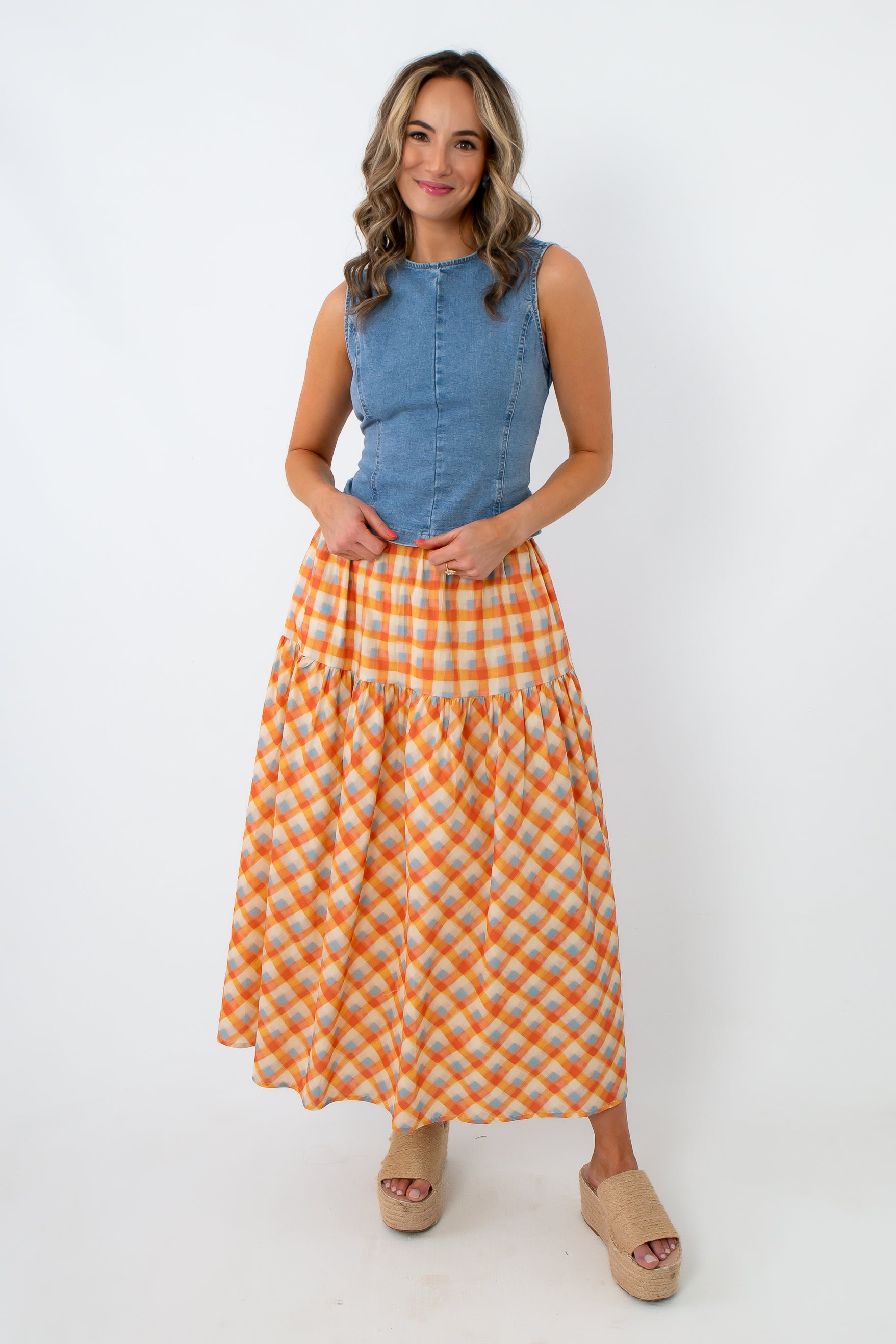 Close-up of denim sleeveless tank top on smiling woman