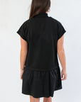 Back view of THML Elise Black Suede Mini Dress showcasing relaxed fit and drop waist design, ideal for versatile styling.