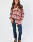 Timeless Magenta Haze Manny Plaid Flannel Shirt featuring a button-down front and classic plaid pattern for versatile styling.