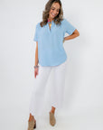 Robin Powder Blue Short Sleeve Blouse styled with white pants