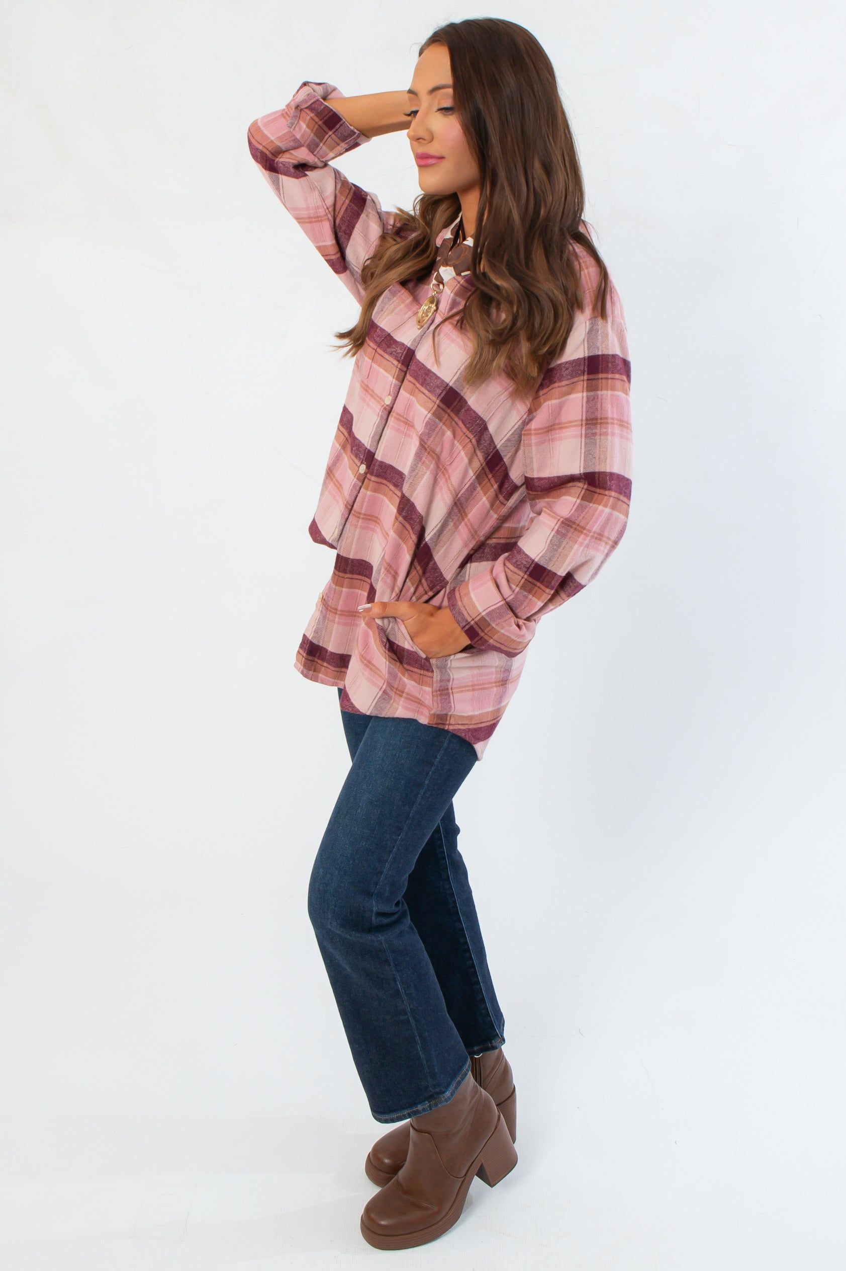 Side view of Magenta Haze Manny Plaid Flannel Shirt showcasing its relaxed silhouette and cozy texture for everyday wear.