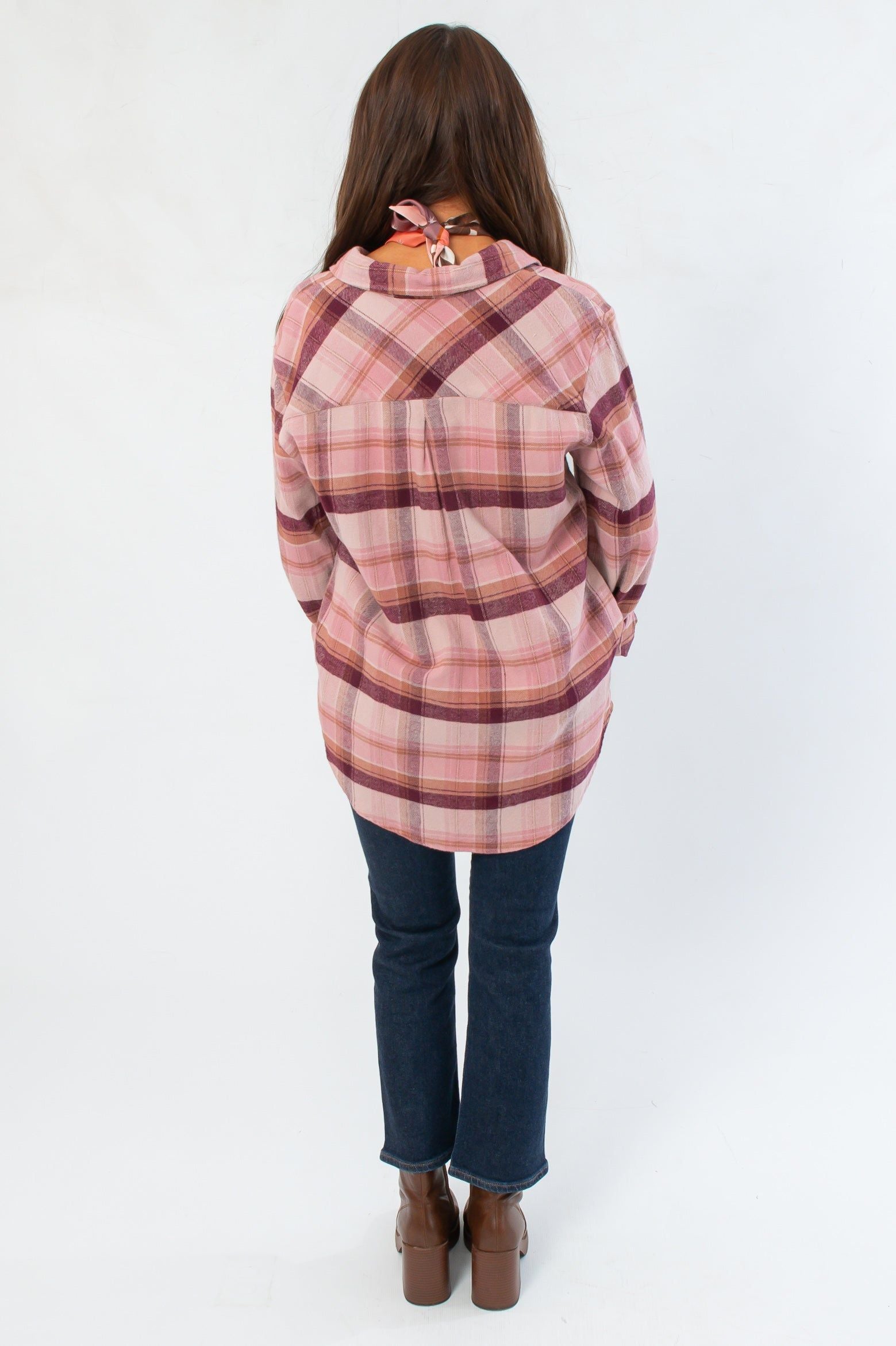Back view of Magenta Haze Manny Plaid Flannel Shirt highlighting the plaid design and loose fit, ideal for layering in cooler seasons.