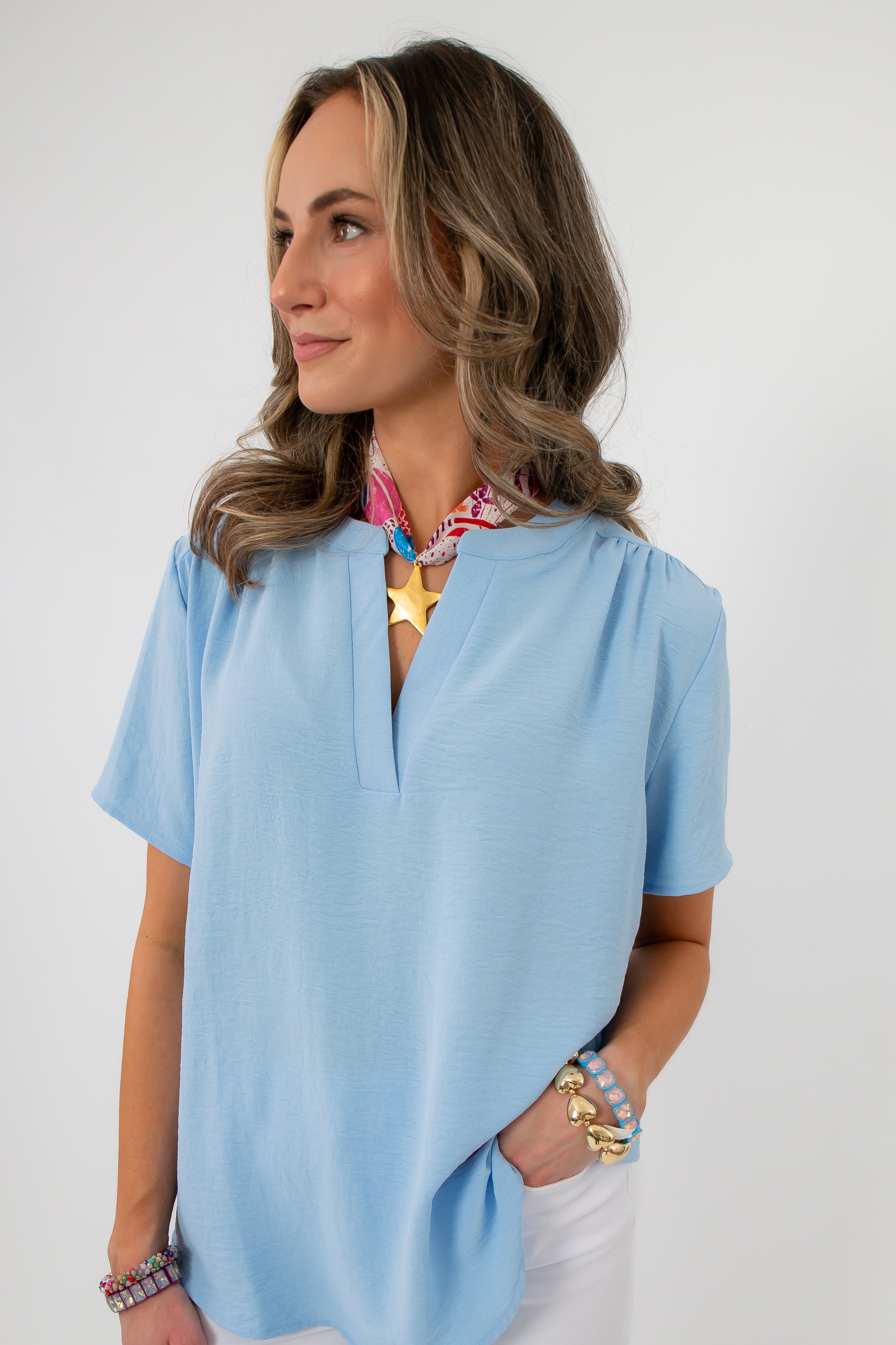 Close-up of Robin Powder Blue Short Sleeve Blouse with accessories