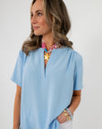 Close-up of Robin Powder Blue Short Sleeve Blouse with accessories