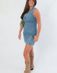 Steve Madden Denim Dress - Averi Blue Denim | Fashion. Side view of fitted blue denim mini dress paired with tan cowboy boots and a green shoulder bag.