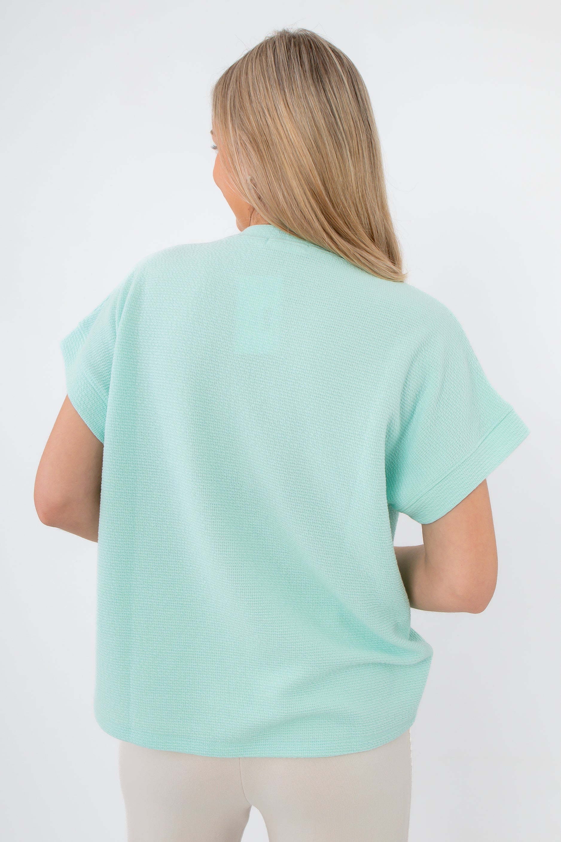 Back view of seafoam ribbed knit short sleeve pocket tee